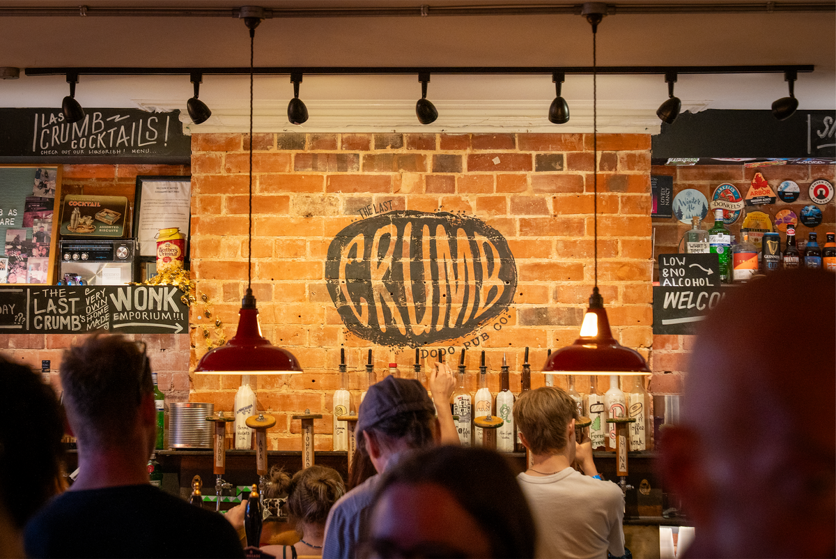 Customers at the bar of The Last Crumb