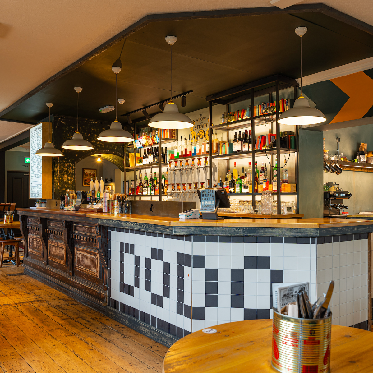 Bar at The Slow & Steady with a tiled Dodo bar front