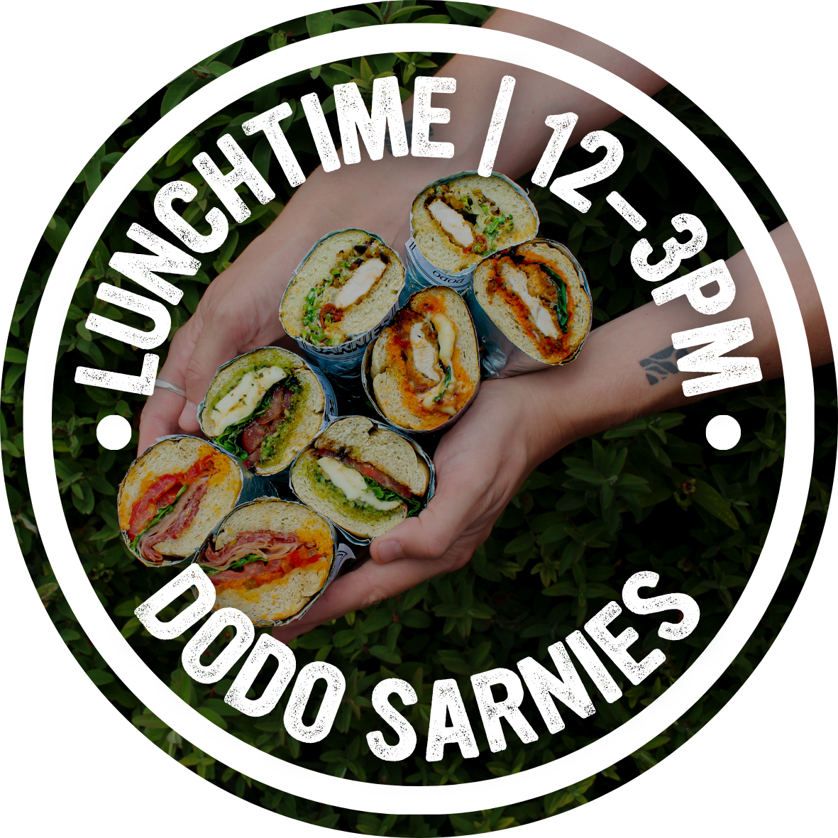 Dodo Sarnies badge over a photo of sandwiches, lunchtime 12pm to 3pm
