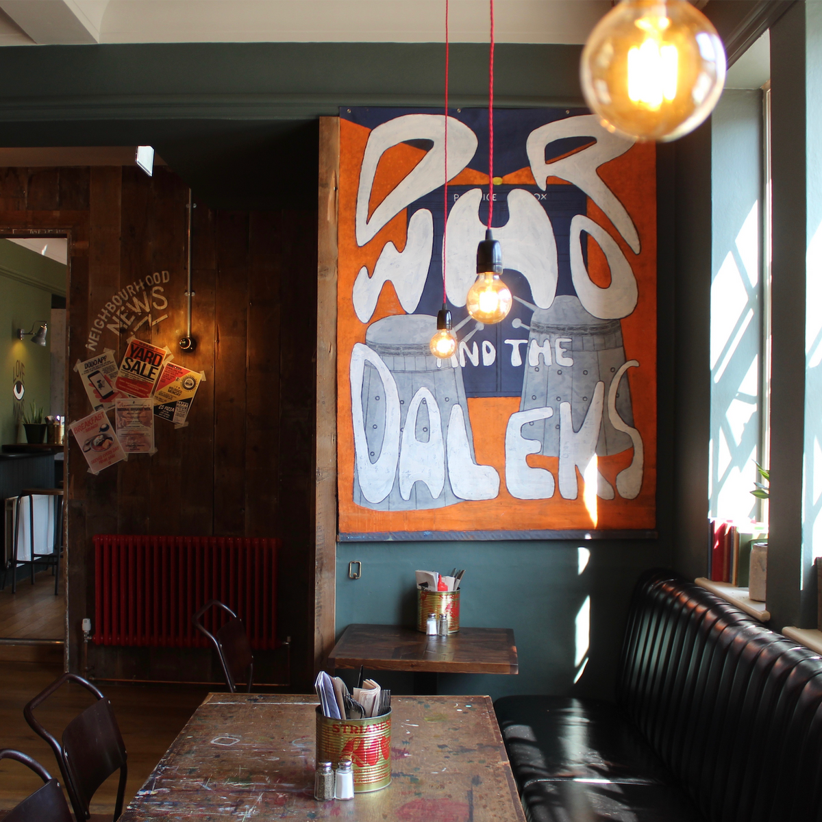 Interior of The Up In Arms with a large vintage Doctor Who and the Daleks poster